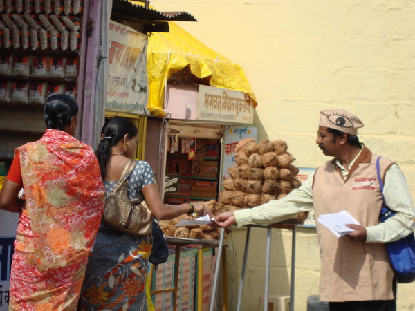 Mr. Kishor Soni distributing eye donation leaflets in Paithan.